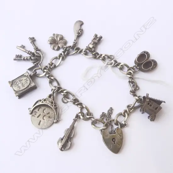 STG SILVER CHARMS & BRACELET, TW 34.3gm