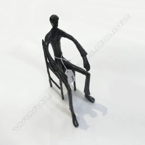 BRONZE STYLISED SCULPTURE OF A SEATED FIGURE tall & thin form H.220mm