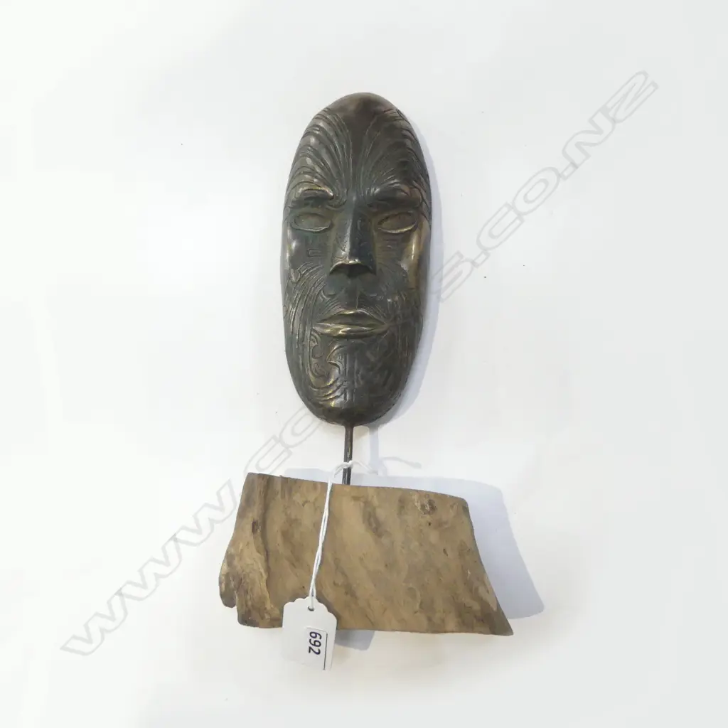 BRONZE MAORI MASK pinned to a wooden base. H.285mm Image 1++