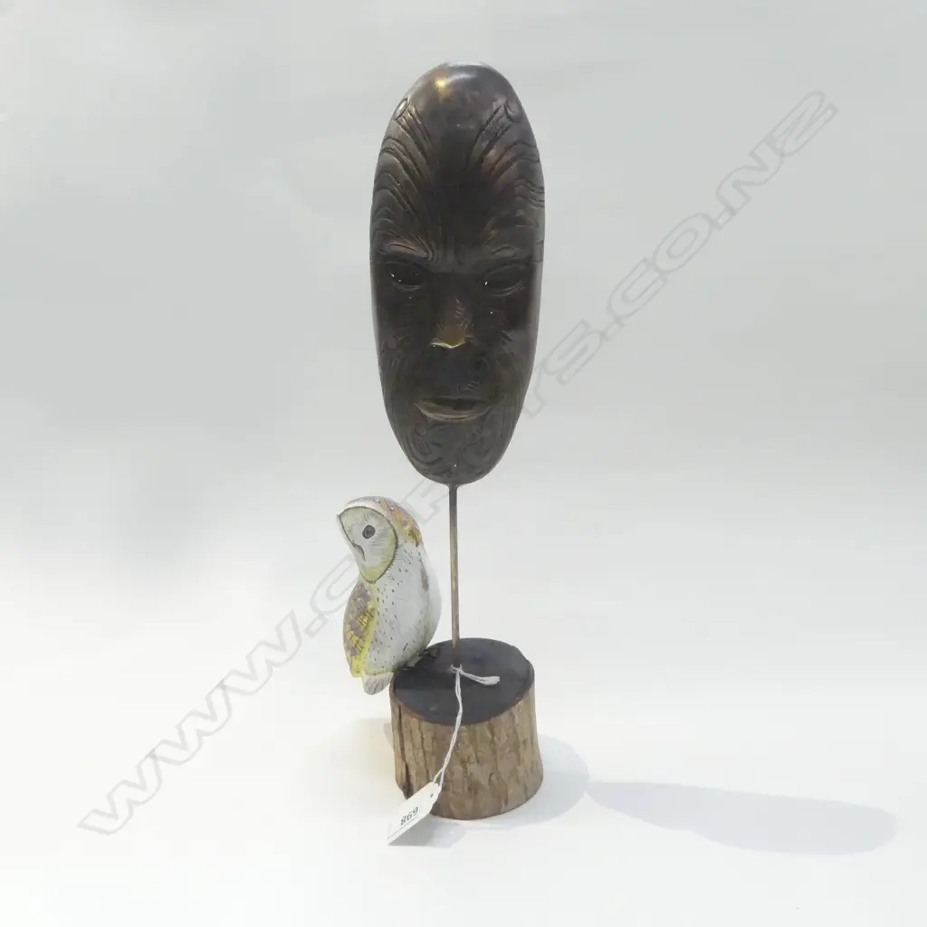 BRONZE MAORI MASK pinned to a wooden base with carved & painted owl. H.365mm Image 1++