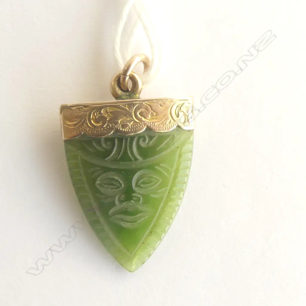 C.1900 9ct GOLD & POUNAMU TOOTH FORM PENDANT engraved with a Maori mask, maker's marks Image 1++