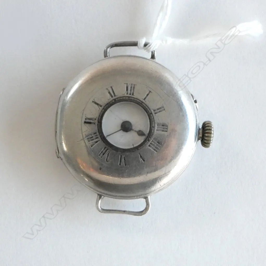 A c.1908 gent's silver half hunter wristwatch, the white enamel dial with black Roman numerals, (hair crack) Image 1++