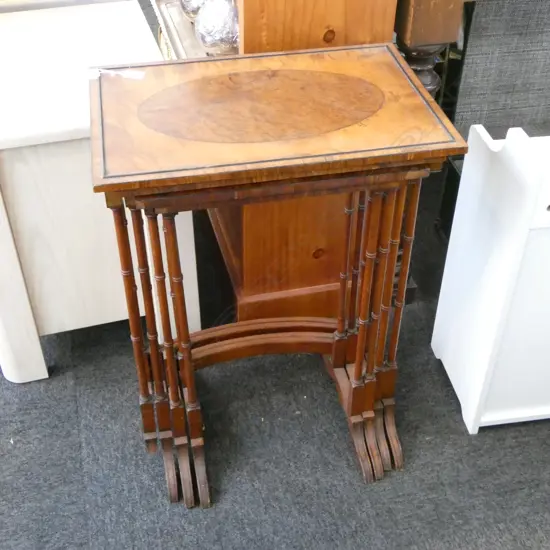 NEST OF 4 MOTTLED KAURI-TOPPED TABLES, W.500mm H.680mm (faults to one foot)