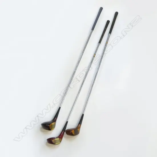THREE 'SPALDING' RIGHT HANDED GOLF CLUBS. Two cream and one brown coloured Catalin faced fairway woods with wood grained heads and metal soles. Good condition clubs with steel shafts and grips