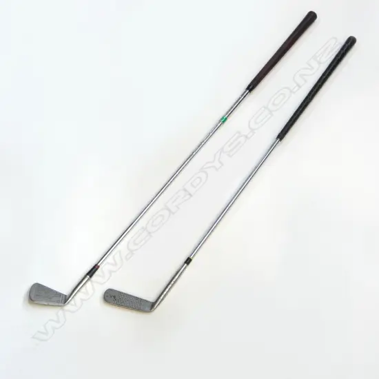 TWO VINTAGE GOLF CLUBS. A vintage “Andy McCallum” steel shafted flat-stick putter number 9 with a leather grip and wooden butt-cap. Rust spotting to putter-head