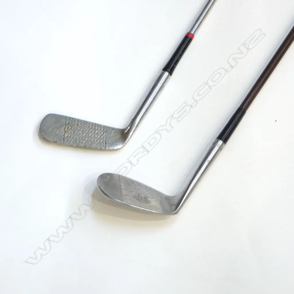 TWO VINTAGE GOLF CLUBS. A vintage large faced “Spalding” number 9 “Niblick Ded-AC” cane shafted wedge club with “Rustless” steel head Image 1++