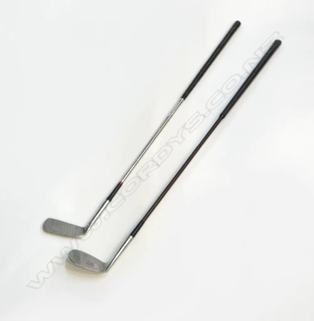 TWO VINTAGE GOLF CLUBS. A vintage large faced “Spalding” number 9 “Niblick Ded-AC” cane shafted wedge club with “Rustless” steel head Image 1++