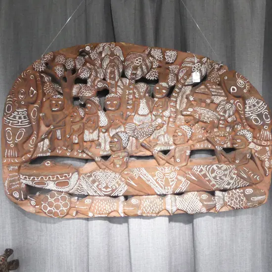 PNG LARGE CARVED WOOD STORY BOARD L.950mm village scene 3 men in crocodile canoe etc