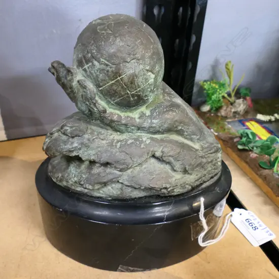 BRONZE SCUPTURE HAND HOLDING THE WORLD BY MARA DOMINIONI H160MM