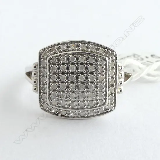 Rhodium plated SILVER & 62 small DIAMOND RING with copy of valuation. As new old shop stock SIZE P