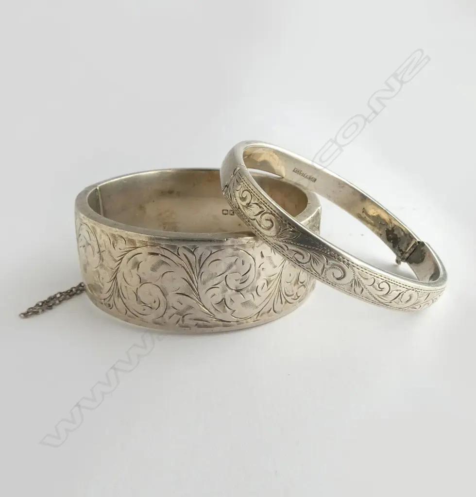 2 SILVER ENGRAVED BANGLES the widest slightly dented. The other narrow bangle with faulty clasp 57.8gms Image 1++