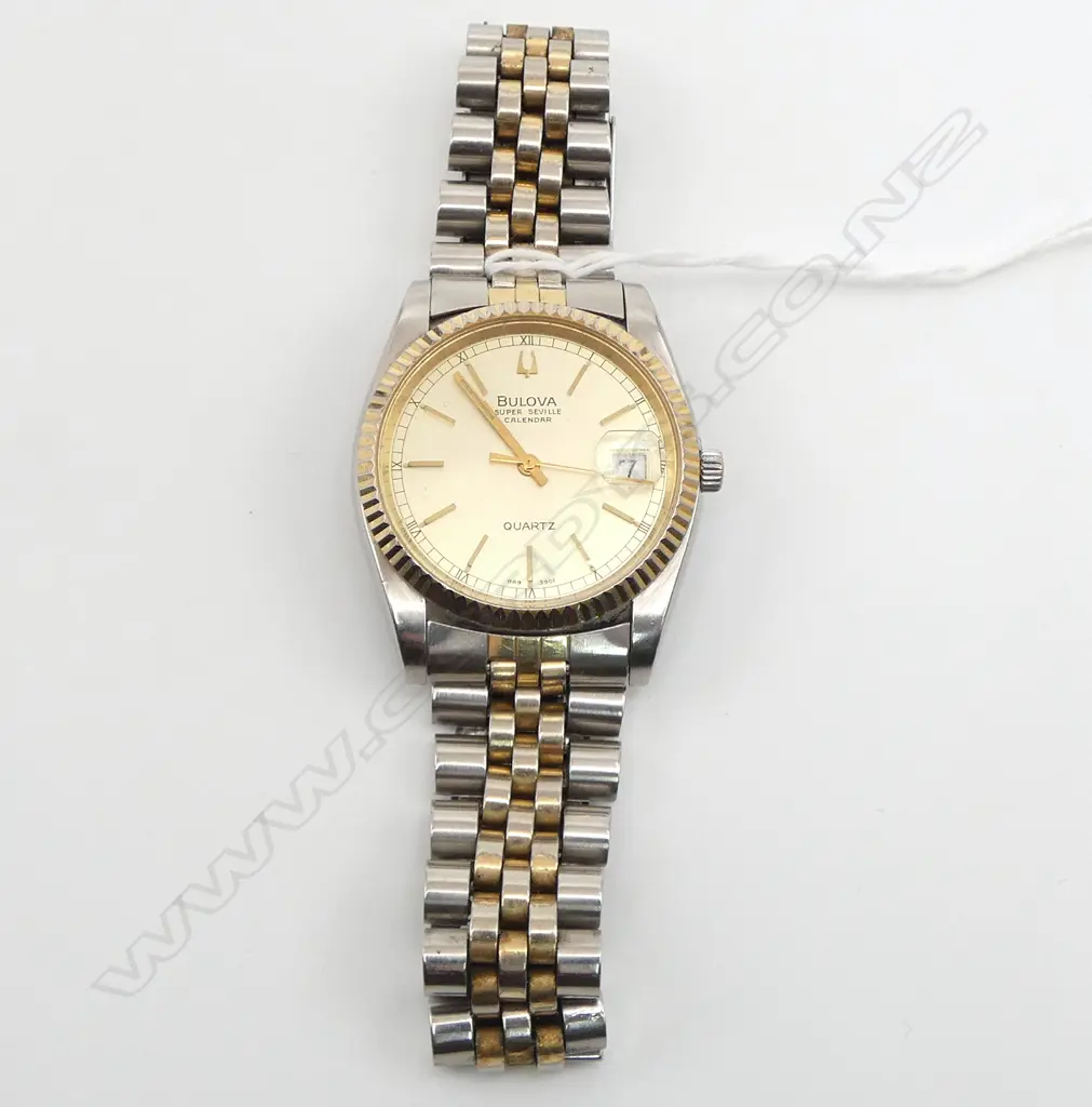 VINTAGE BULOVA SUPER SEVILLE CALENDER GENT'S GOLD PLATE & stainless WRISTWATCH w stainless strap. c.1980. Working Image 1++