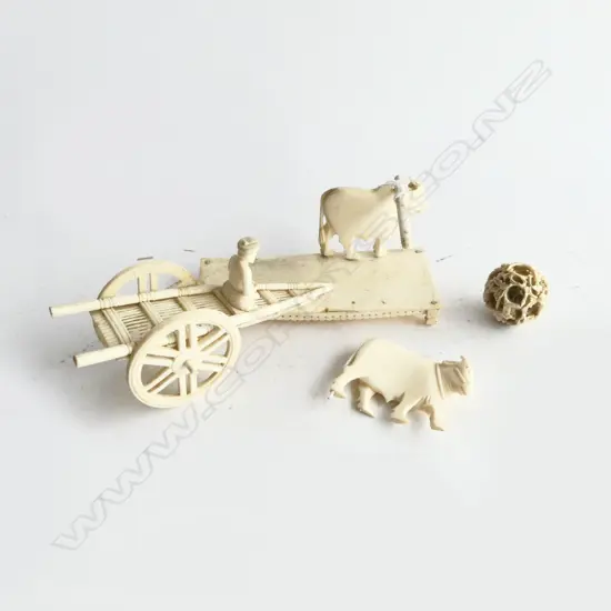 OLD INDIAN CARVED IVORY 2 OX PULLING CART SCULPTURE on plinth. Minor faults. L.120mm. + Chinese ivory puzzle ball