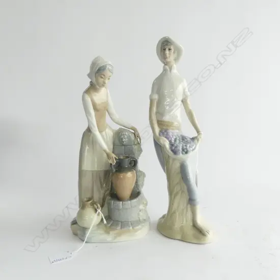 2 FIGURINES; NAO WOMAN AT WELL, MAN w. GRAPES H.330mm