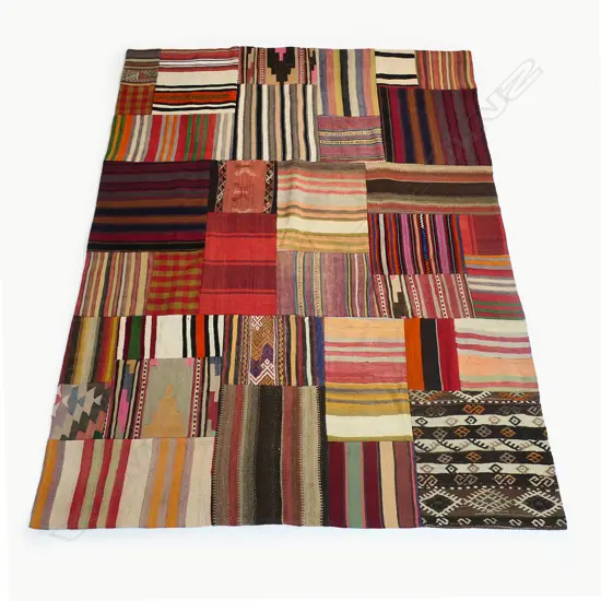 A Turkish patchwork kilim carpet, comprising old kilims of various colours and patterns. 2400 x 1800mm.