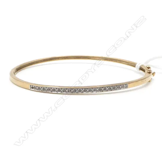 9CT DIAMOND BANGLE, 7.6gms (1 small diamond missing on the end)