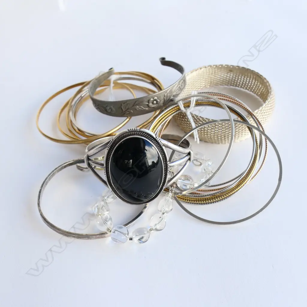 ASST. BRACELETS INCLDS; 5 GOLD PLATE INTERLOCKED BANGLES. (Marked 18ct BUT NOT) Image 1++
