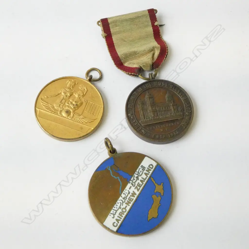 3 N.Z. MEDALS; WW2 CAIRO-N.Z. BRONZE & ENAMEL MEDAL TO J.C. SINCLAIR, EGYPT-N.Z. ROWING MEDAL & CHRISTCHURCH SACRAMENTAL Image 1++