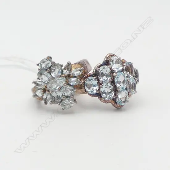 2 STG SILVER RINGS with pale blue stones Size L & N