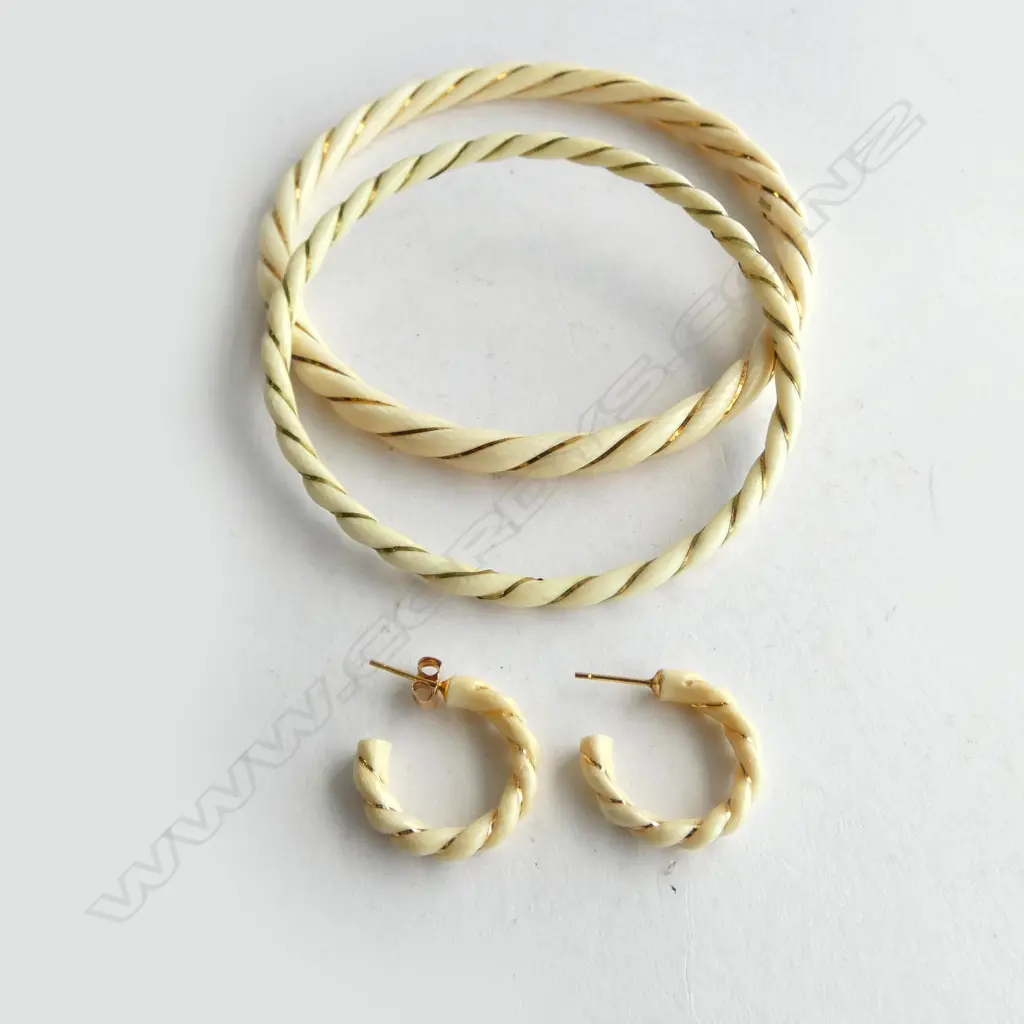 TWO IVORY AND GOLD TWIST BANGLES AND PAIR OF MATCHING EARRINGS Image 1++