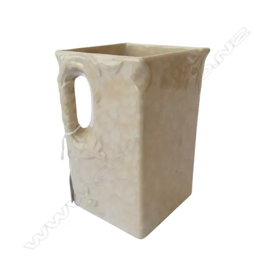 NZ TEMUKA ART DECO JUG diamond form mottled pale apricot/tan glaze. Printed marks to base. H.153mm