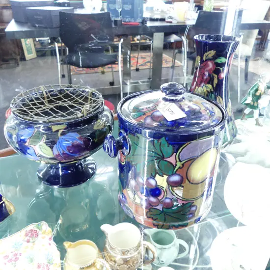 3 'JACOBEAN' ROYAL STANLEY WARE CERAMIC PCES: lidded biscuit barrel + 2 vases. fruit & florals on indigo. Tallest 215mm
