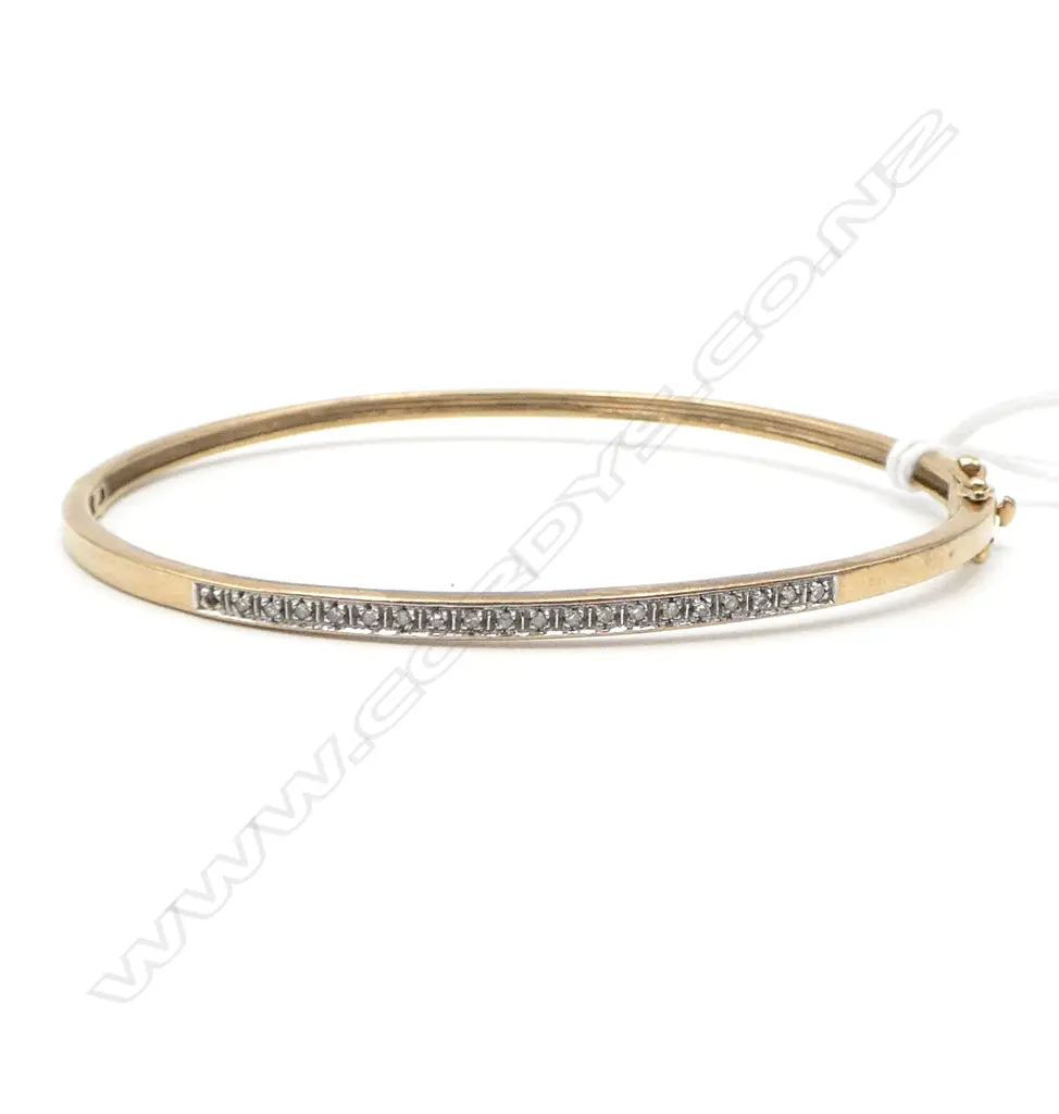 9CT DIAMOND BANGLE, 7.6gms (1 small diamond missing on the end) Image 1++