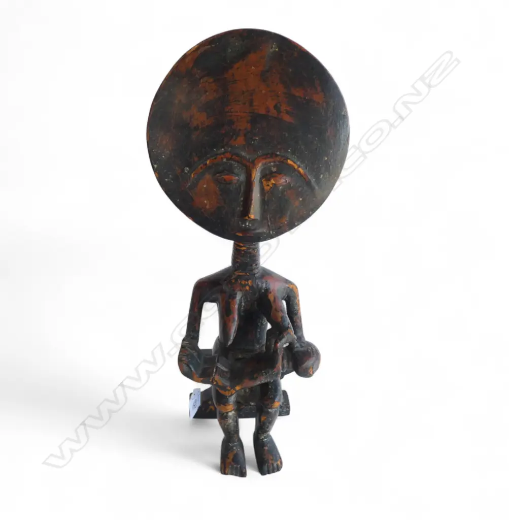 An African carved wood figure Image 1++