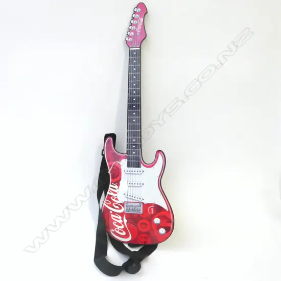 Toy guitar plays music. Branded Coca-Cola. L.740mm