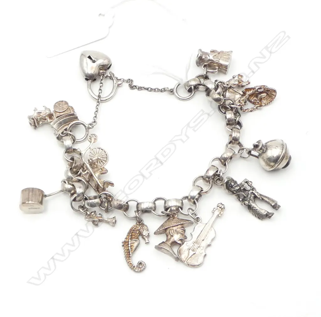 SILVER CHARM BRACELET WITH 14 CHARMS  51.64gms Image 1++