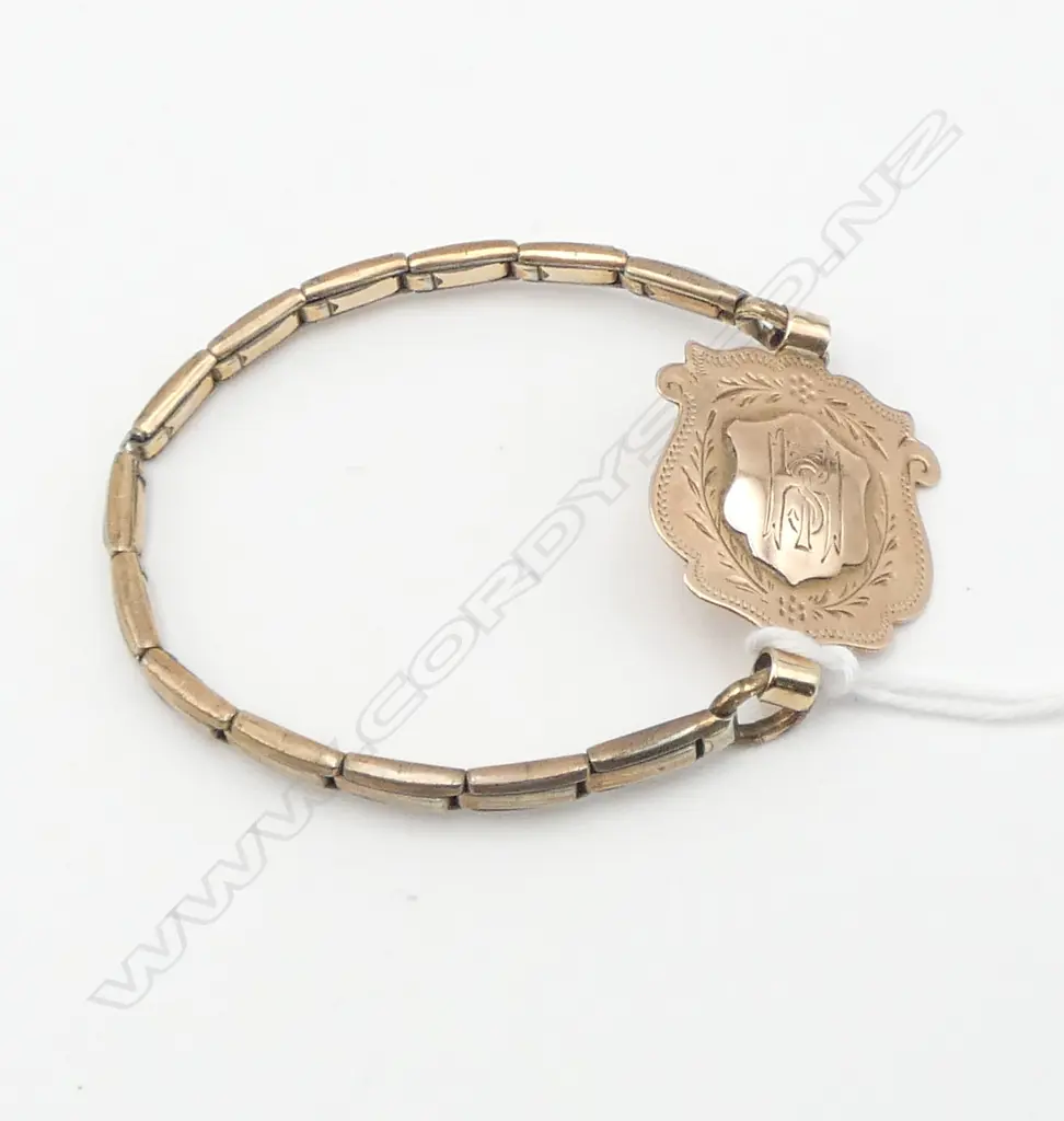 9ct GOLD FOB SHIELD ENGRAVED 'L.J. HILL DUX 1933' ON G/P BRACELET Image 1++