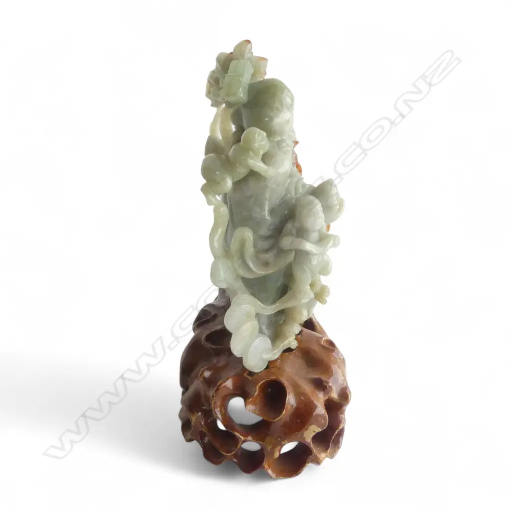 CHINESE CARVED GREEN JADE BUDDHA with red brown highlights on carved stand H.,165mm. Image 1++