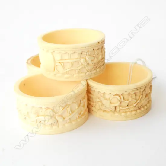 4 CARVED IVORY NAPKIN RINGS