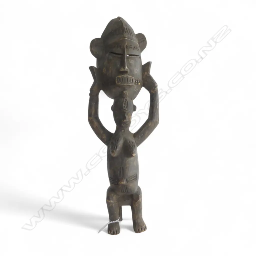 An African carved wood figure Image 1++