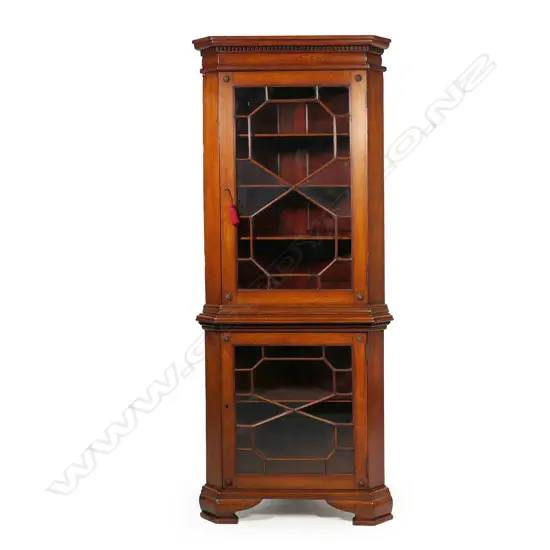A George III two-piece oak standing corner cabinet,