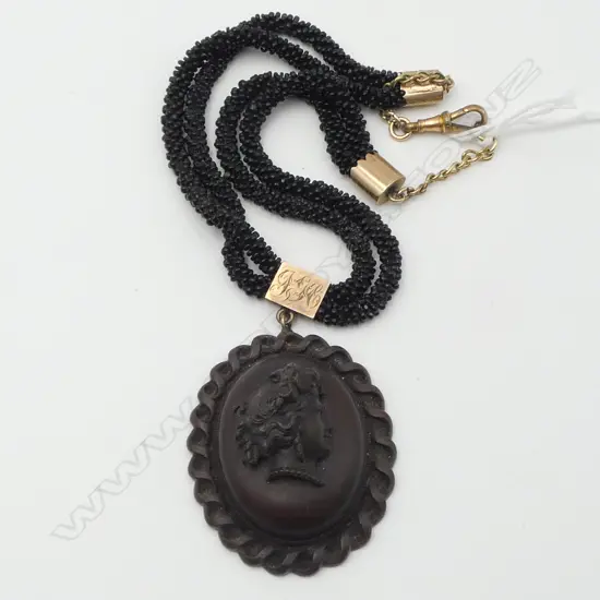 VICTORIAN VULCANITE PENDANT ON JET BEAD NECKLACE WITH 9CT GOLD CAPS