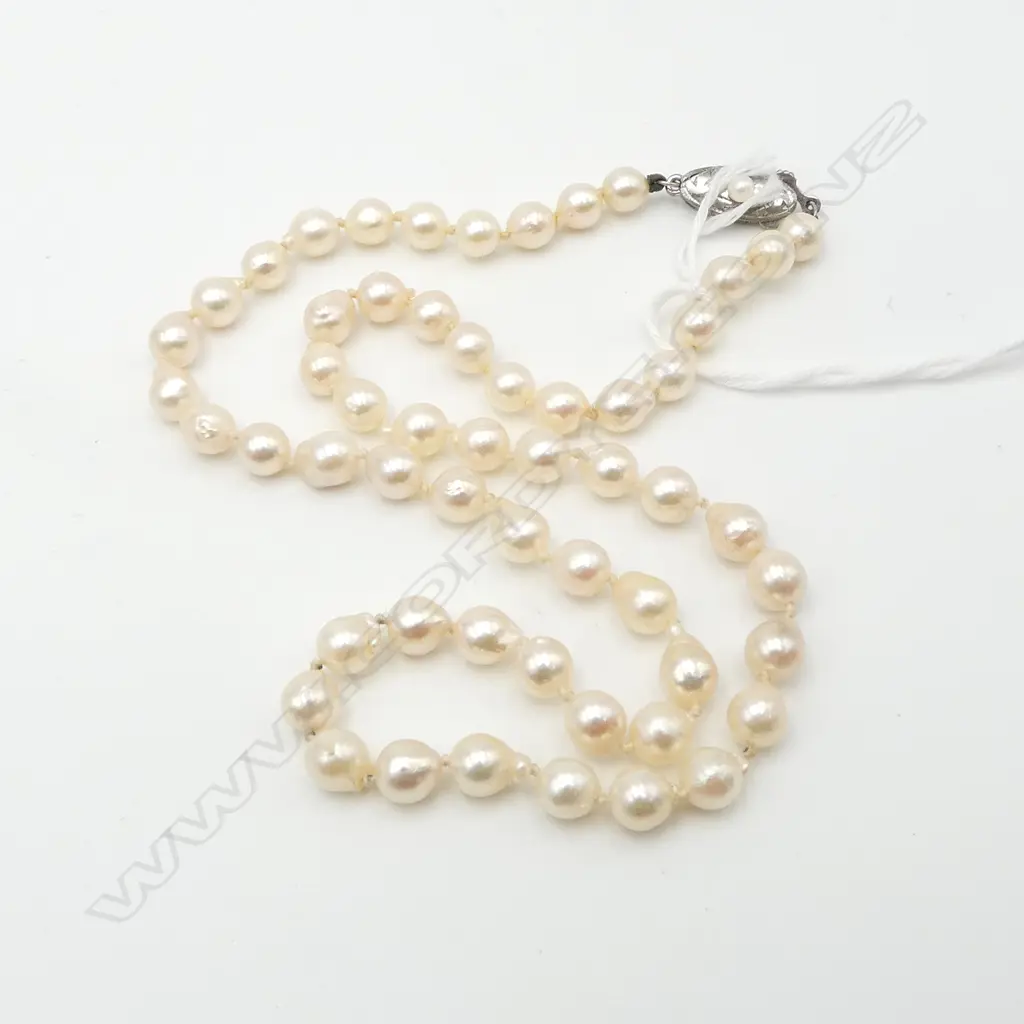 SINGLE STRAND OF SEMI-BAROQUE PEARLS Image 1++