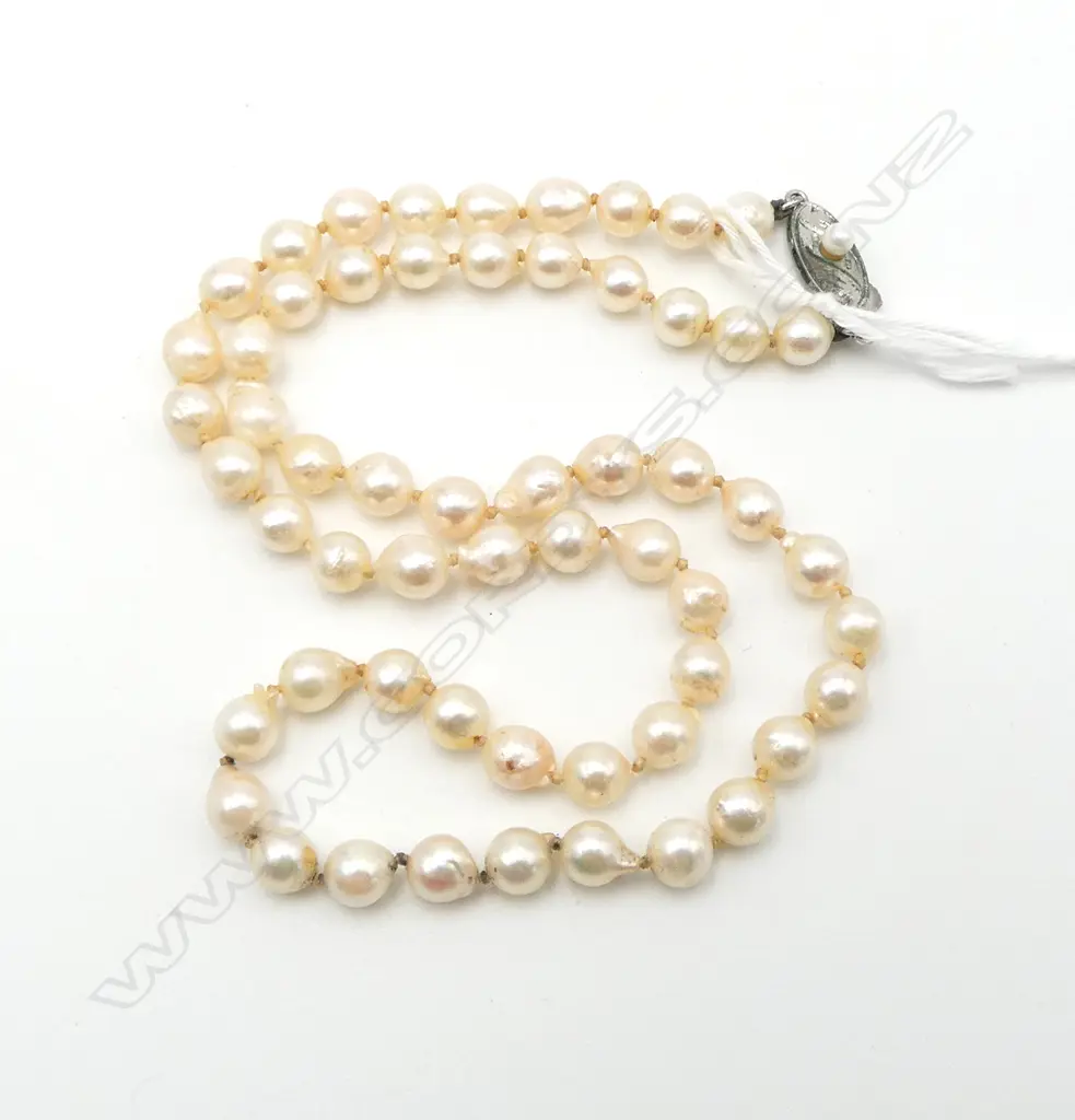 SINGLE STRAND OF SEMI-BAROQUE PEARLS Image 1++