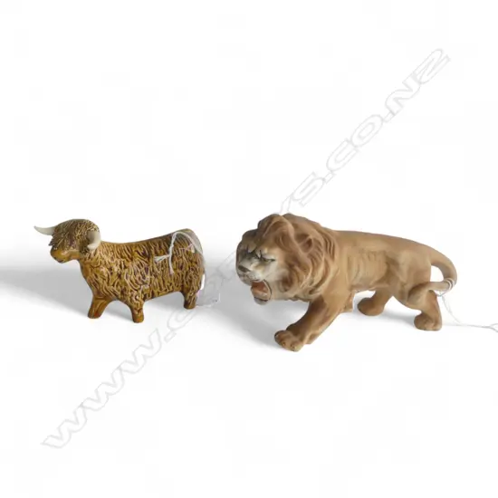 TWO POTTERY ORNAMENTS; LION & HIGHLAND CATTLE, H.80 x 160mm, 70 x 120mm