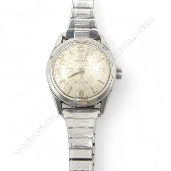 1970's TISSOT LADIES WATCH stainless with papers. Running. Glass crazed