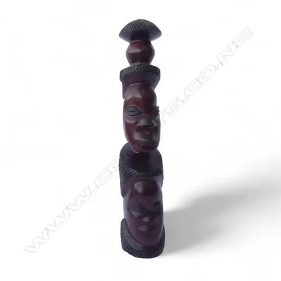 A HEAVY AFRICAN EBONY CARVING OF 3 FACES, L.450MM