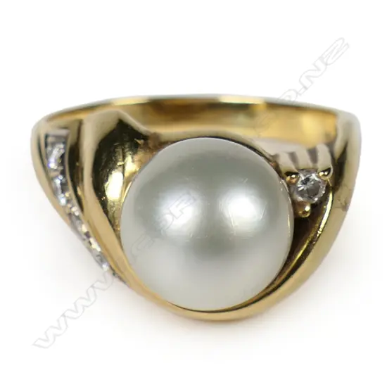 An 18ct gold pearl and diamond ring,
