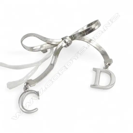 CHRISTIAN DIOR SILVER PLATED BOW BROOCH
