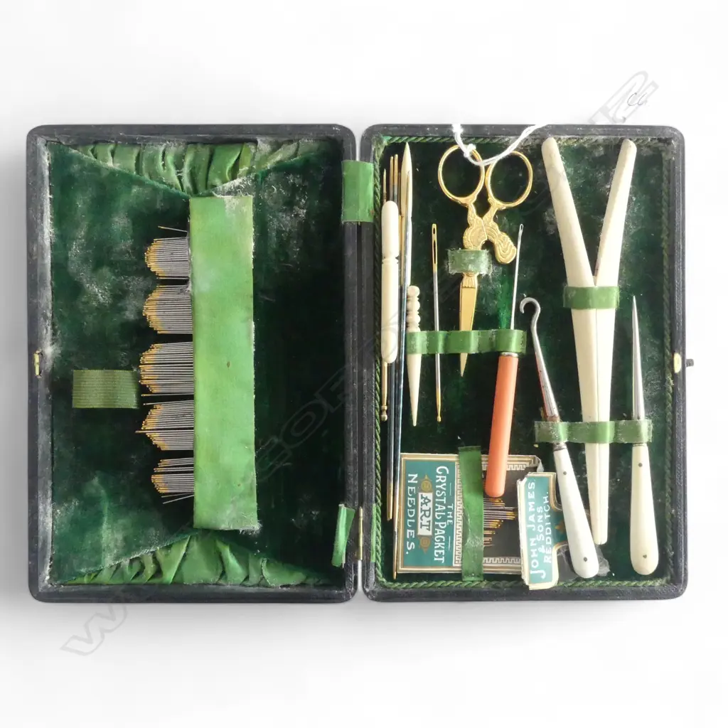 EDWARDIAN LEATHER CASED SEWING SET: various bone implements + scissors + needles etc Image 1++
