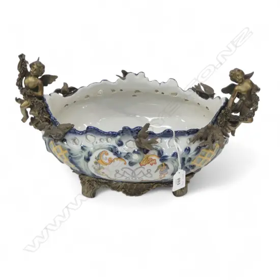 A WONG LEE PORCELAIN CENTREPIECE WITH BRASS HANDLES FASHIONED AS CHERUBS  220mm (H)