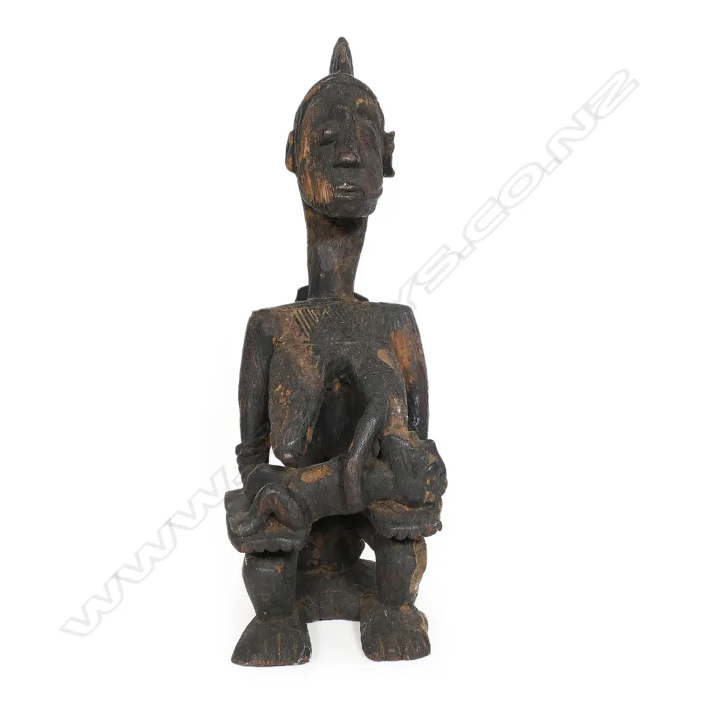 A Nigerian tribal carved wood mother and children figure group, Image 1++