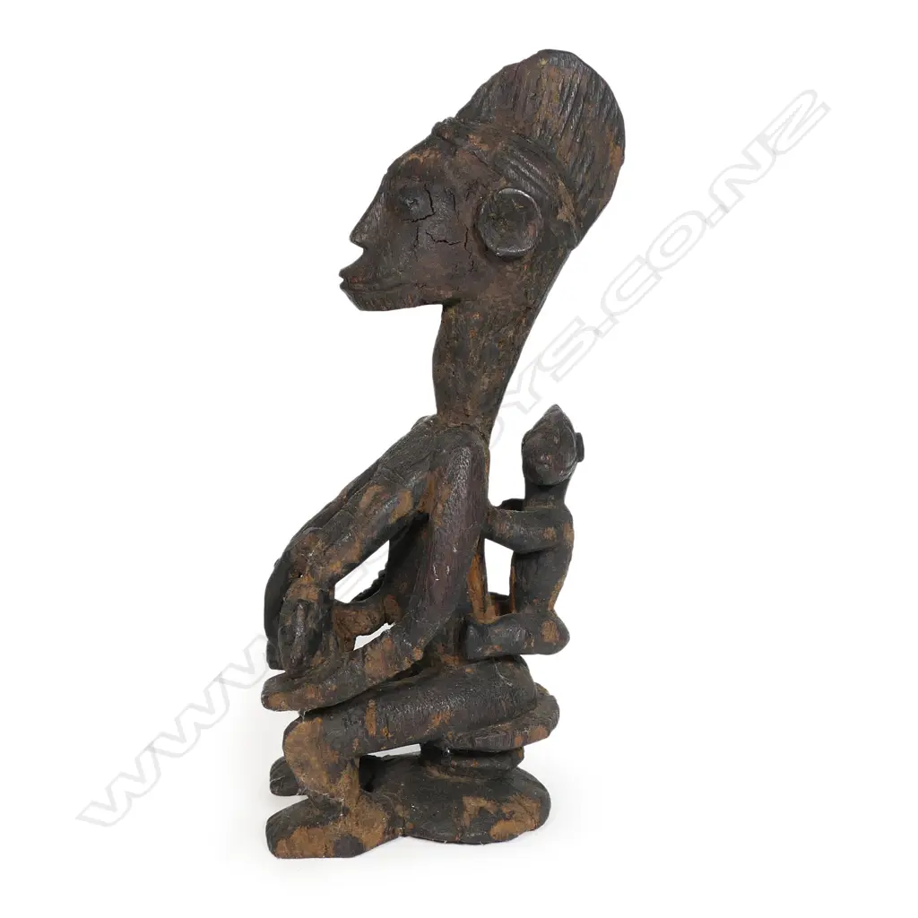 A Nigerian tribal carved wood mother and children figure group, Image 1++