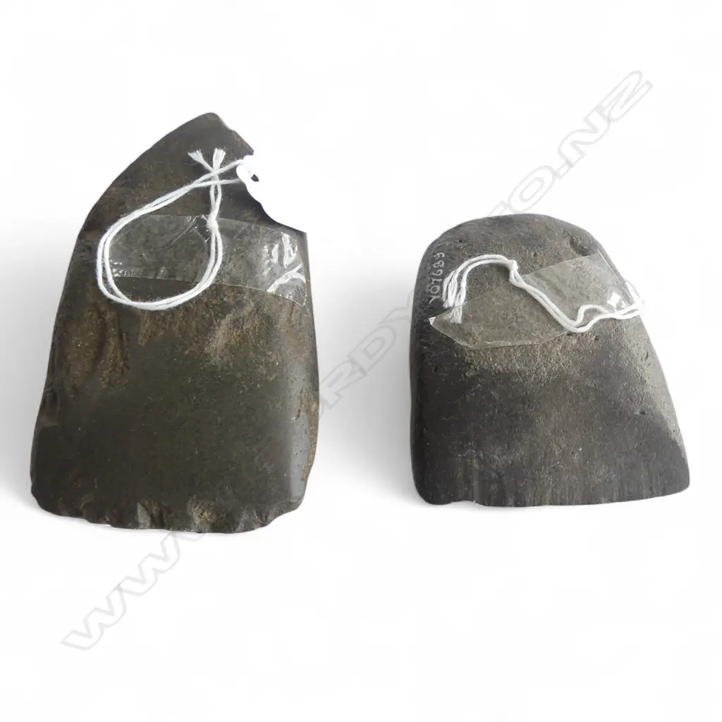 Two Māori pre-European stone toki. Both registered. One broken Y10246 L.110mm. Y07689. L.76mm. Note: Buyer must be registered to purchase. Image 1++