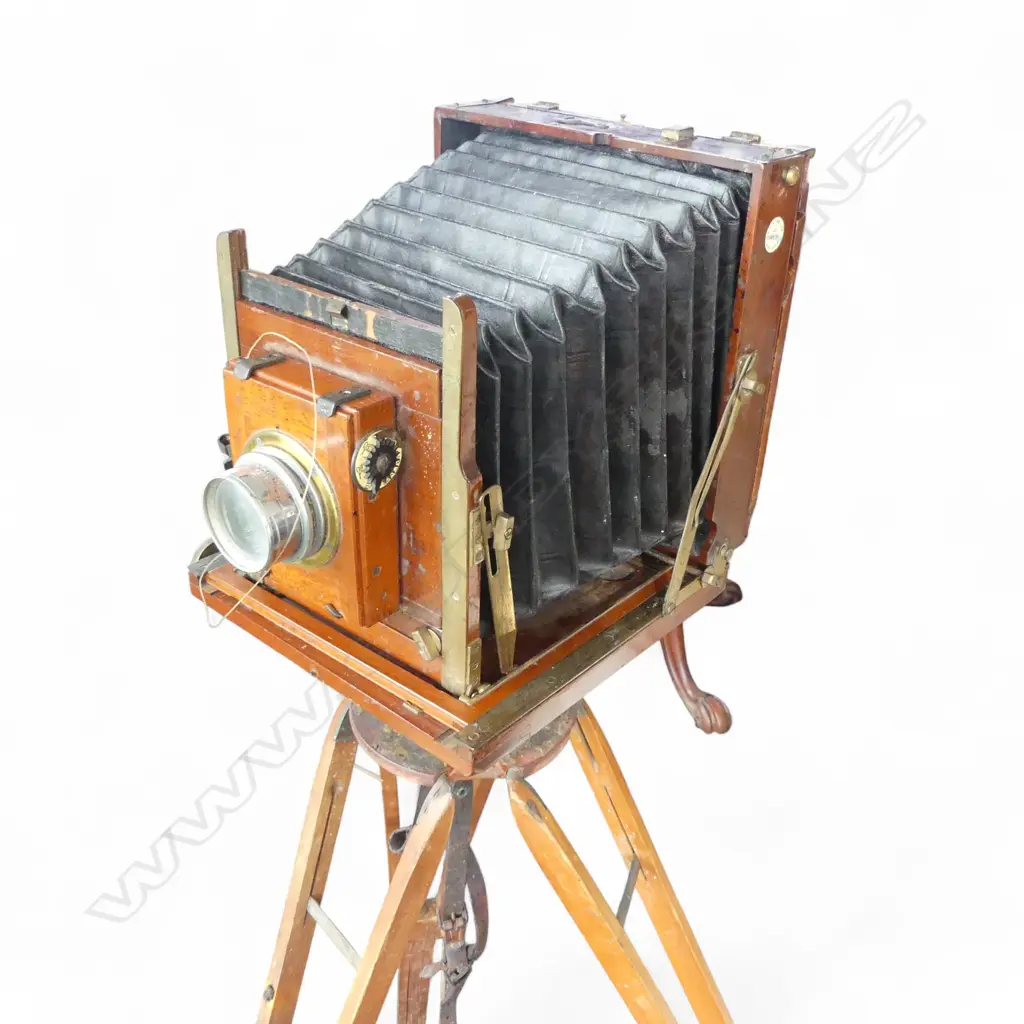 EARLY 20thC THORNTON PICKARD RUBY CAMERA, TRIPOD & LENS by Walter Suckling (N.Z.). H.1280mm Image 1++