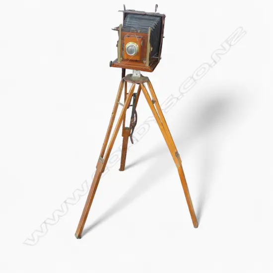 EARLY 20thC THORNTON PICKARD RUBY CAMERA, TRIPOD & LENS by Walter Suckling (N.Z.). H.1280mm